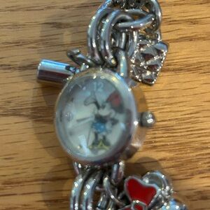 Silver Minnie Mouse Charm Bracelet Watch with charms.
